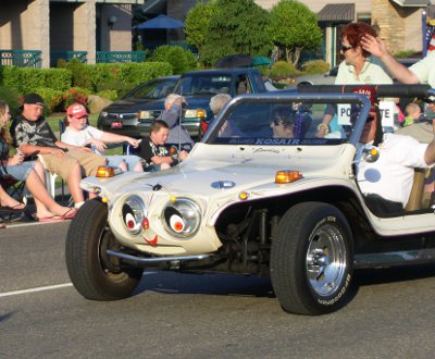 [Headlights are eyes and rest of front of vehicle is made into a face.]